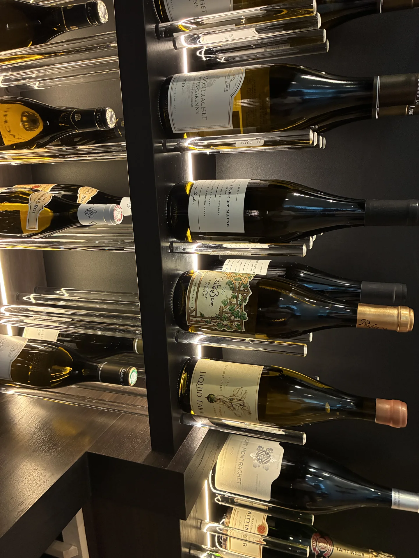 Wine bottles suspended on the patent-pending Glass Rod System