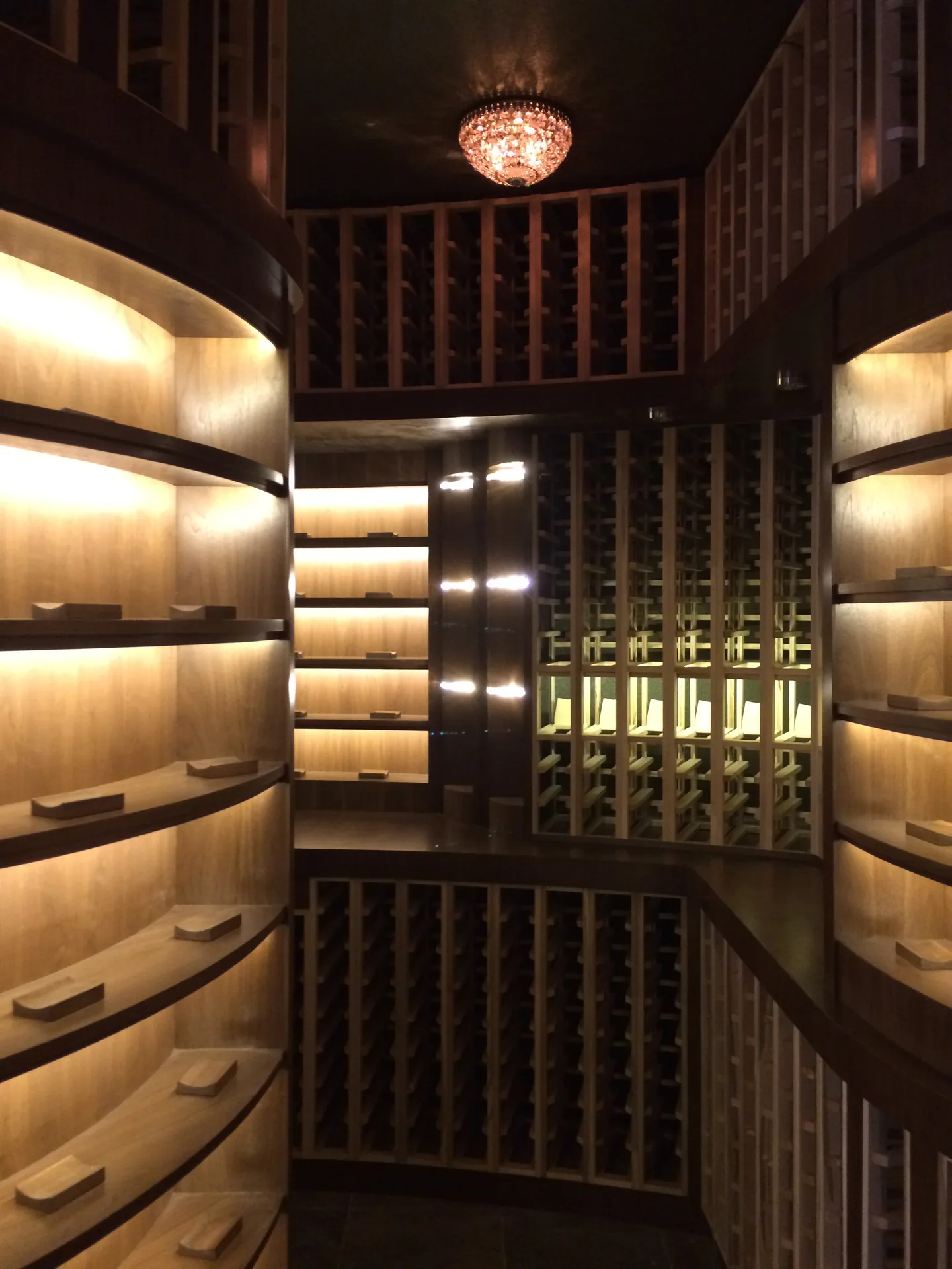 Doc Watters hand-finishing custom wine cellar racking on site